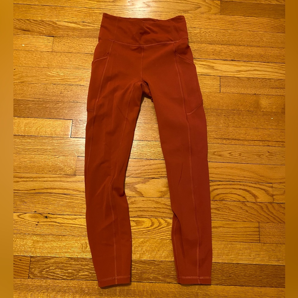 Lululemon orange leggings size 4